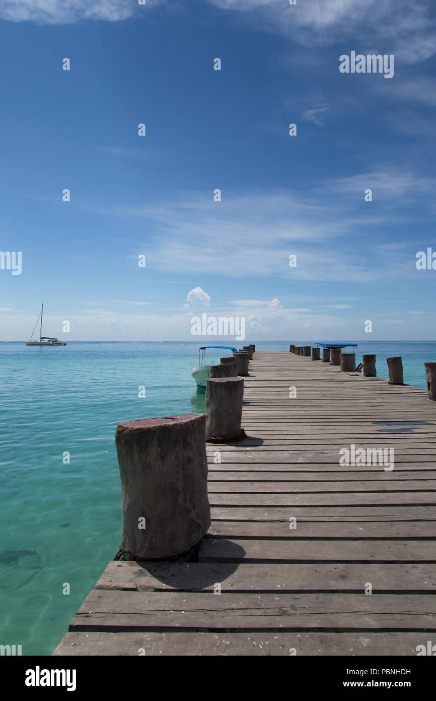 Empty wooden jetty in a lonely environment with a fantastic sea view of the Caribbean Sea Stock Photo