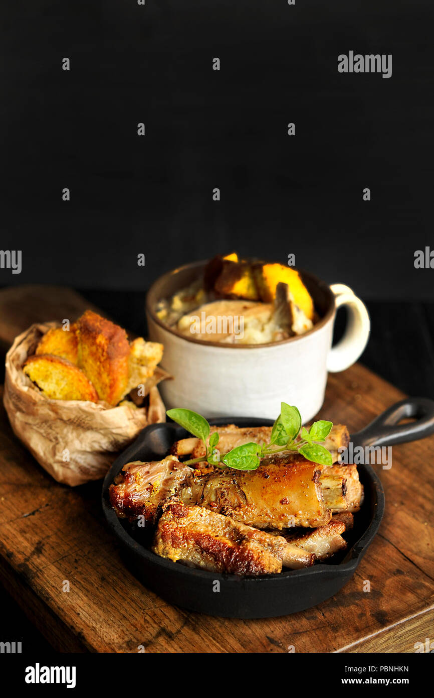 roasted ribs and soup, and fried potatoes. Copy space. Stock Photo