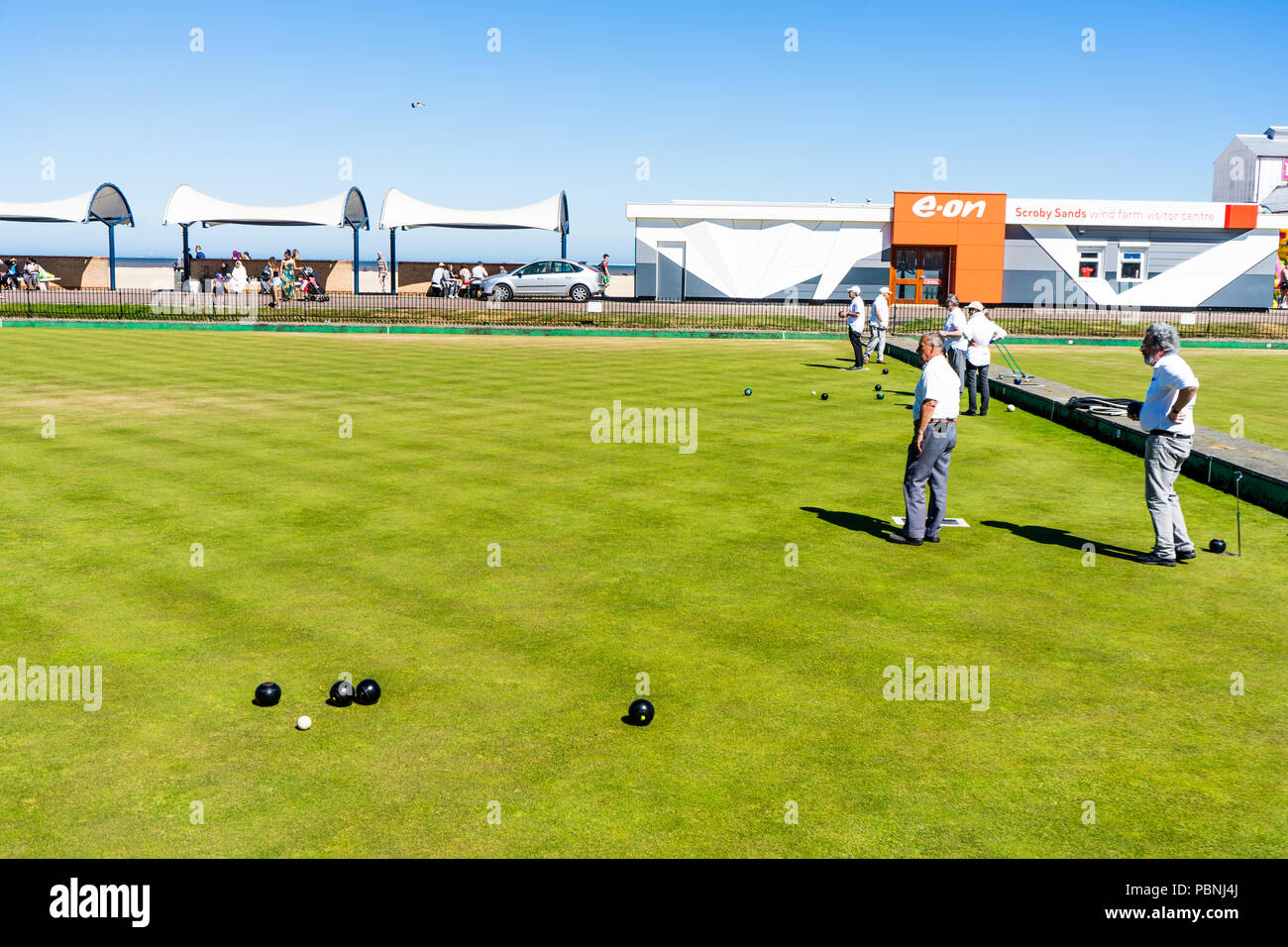 Men playing bowls at the bowling club  Greate Yarmouth, England. Bowls Tournaments in Greater Yarmouth.The bowling green. Stock Photo