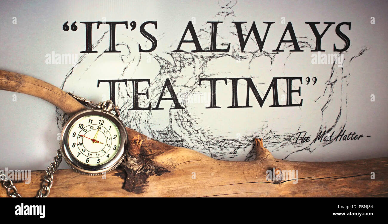 It´s always time for tea - silver pocket watch with chain on a tree branch quoting the Mad Hatter from Alice in Wonderland Stock Photo