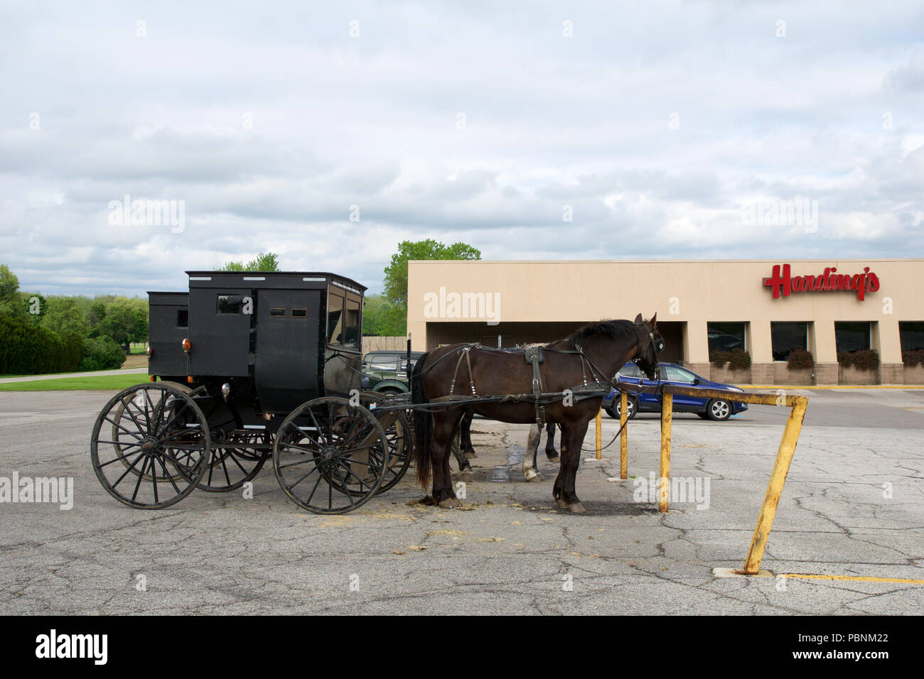 MIDDLEBURY, INDIANA, UNITED STATES - MAY 22nd, 2018: View of amish carriage along the city, known for simple living with touch of nature contacy, plain dress, and reluctance to adopt conveniences of modern technology Stock Photo