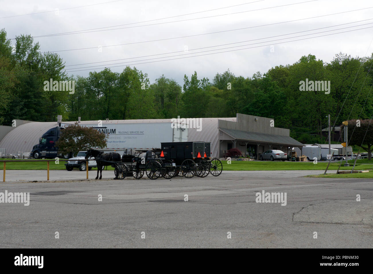MIDDLEBURY, INDIANA, UNITED STATES - MAY 22nd, 2018: View of amish carriage along the city, known for simple living with touch of nature contacy, plain dress, and reluctance to adopt conveniences of modern technology Stock Photo