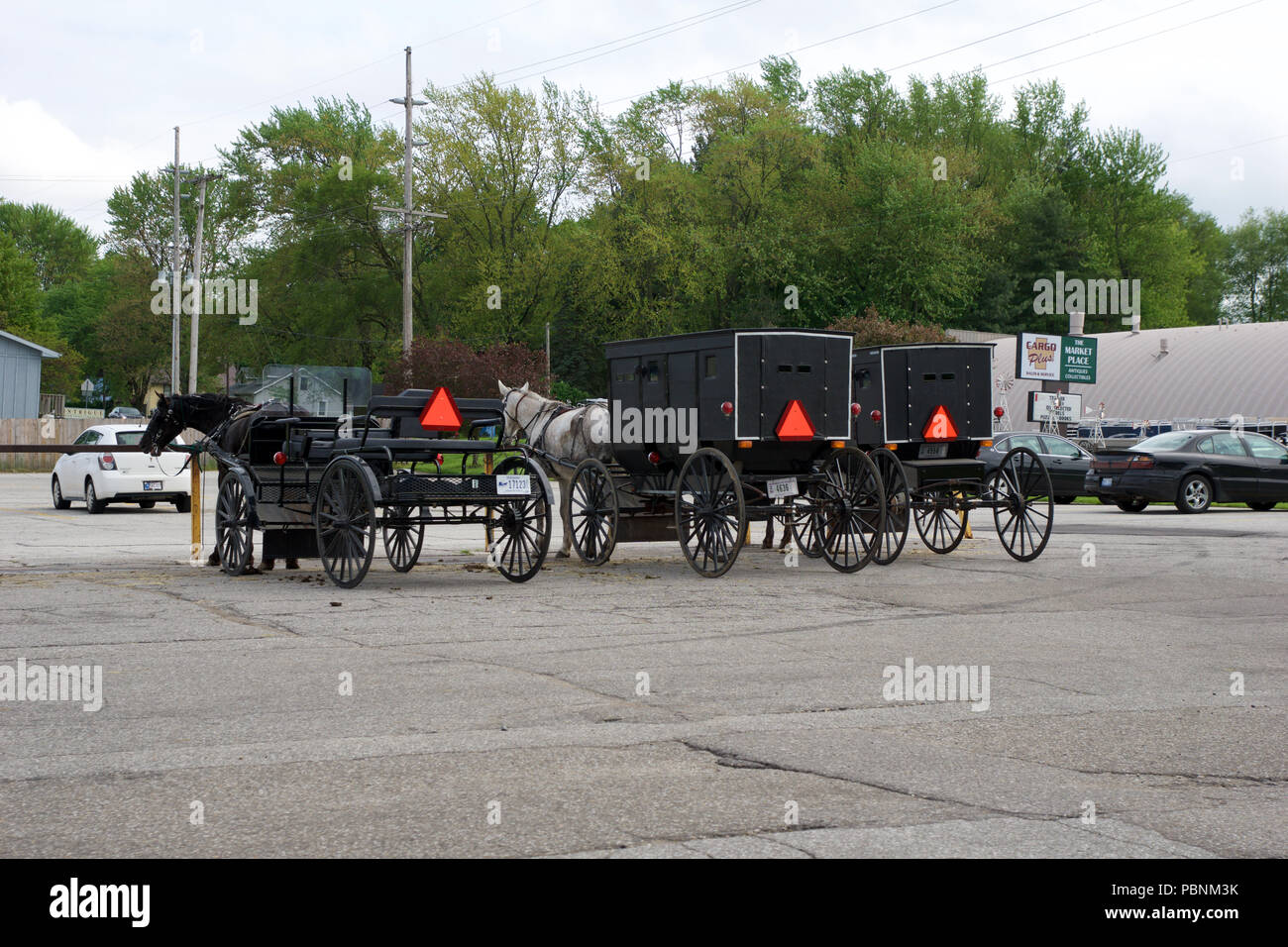 MIDDLEBURY, INDIANA, UNITED STATES - MAY 22nd, 2018: View of amish carriage along the city, known for simple living with touch of nature contacy, plain dress, and reluctance to adopt conveniences of modern technology Stock Photo