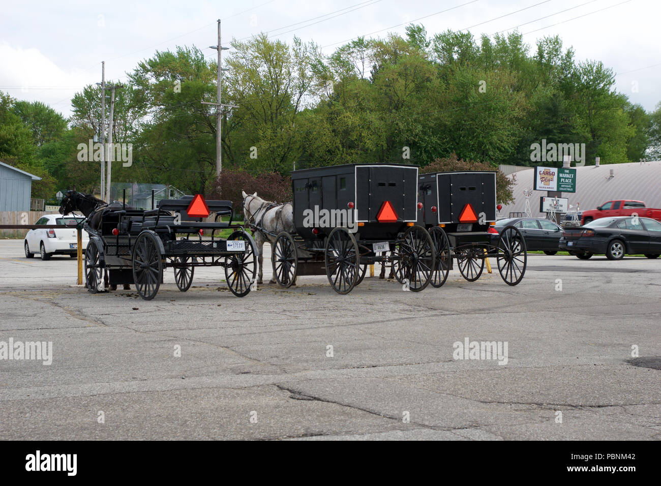 MIDDLEBURY, INDIANA, UNITED STATES - MAY 22nd, 2018: View of amish carriage along the city, known for simple living with touch of nature contacy, plain dress, and reluctance to adopt conveniences of modern technology Stock Photo