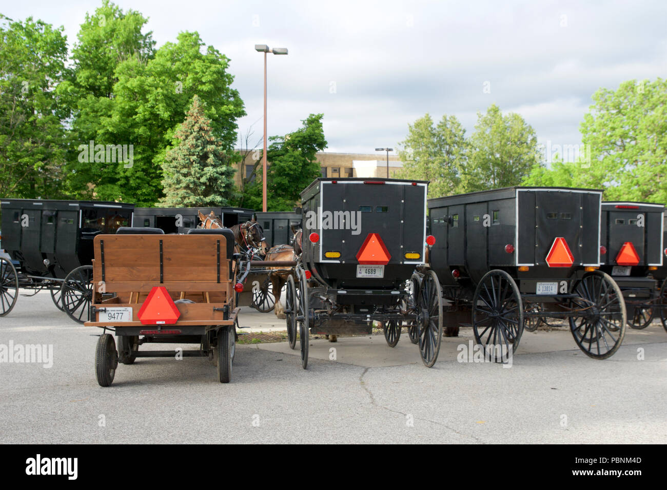 MIDDLEBURY, INDIANA, UNITED STATES - MAY 22nd, 2018: View of amish carriage along the city, known for simple living with touch of nature contacy, plain dress, and reluctance to adopt conveniences of modern technology Stock Photo