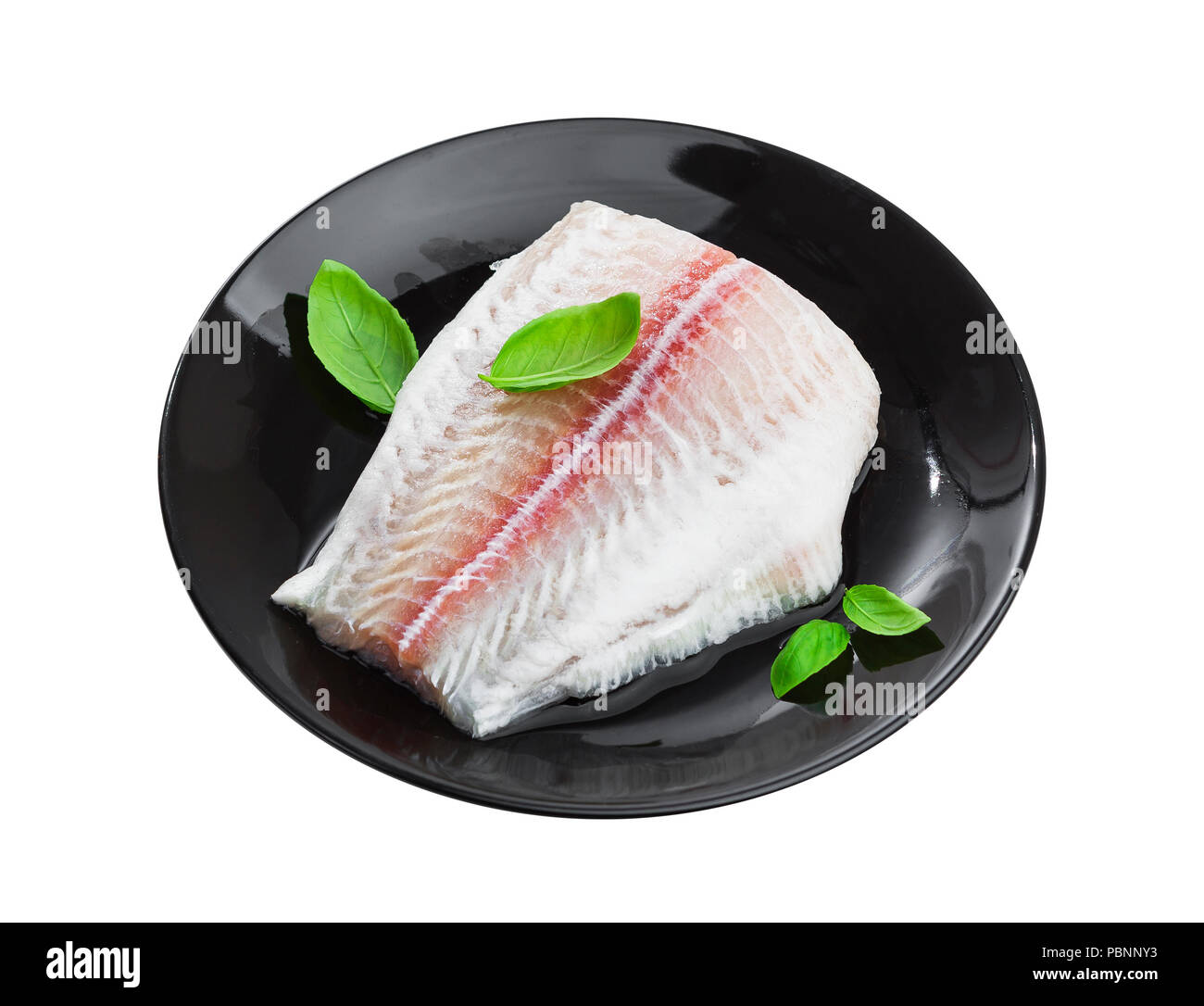Fresh fish fillet of pangasius on plate isolated on white background with clipping path Stock Photo