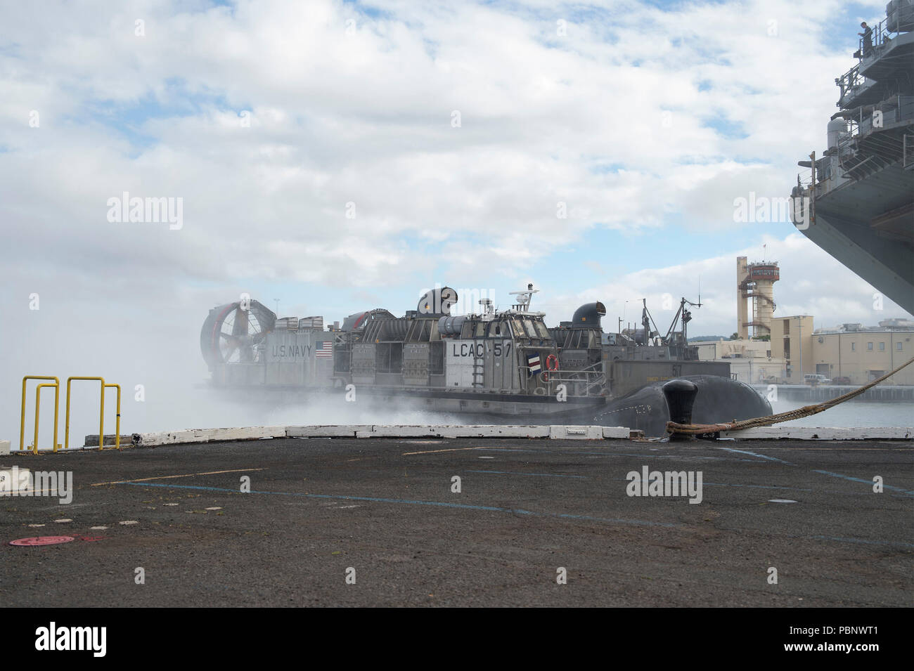 180726-N-XK809-1046 PEARL HARBOR, Hawaii (July 26, 2018) Landing craft air cushion (LCAC) 57, assigned to Assault Craft Unit (ACU) 5, departs the well deck of the amphibious assault ship USS Bonhomme Richard (LHD 6). Bonhomme Richard is currently underway in the U.S. 3rd Fleet area of operations. (U.S. Navy photo by Mass Communication Specialist 2nd Class William Sykes) Stock Photo