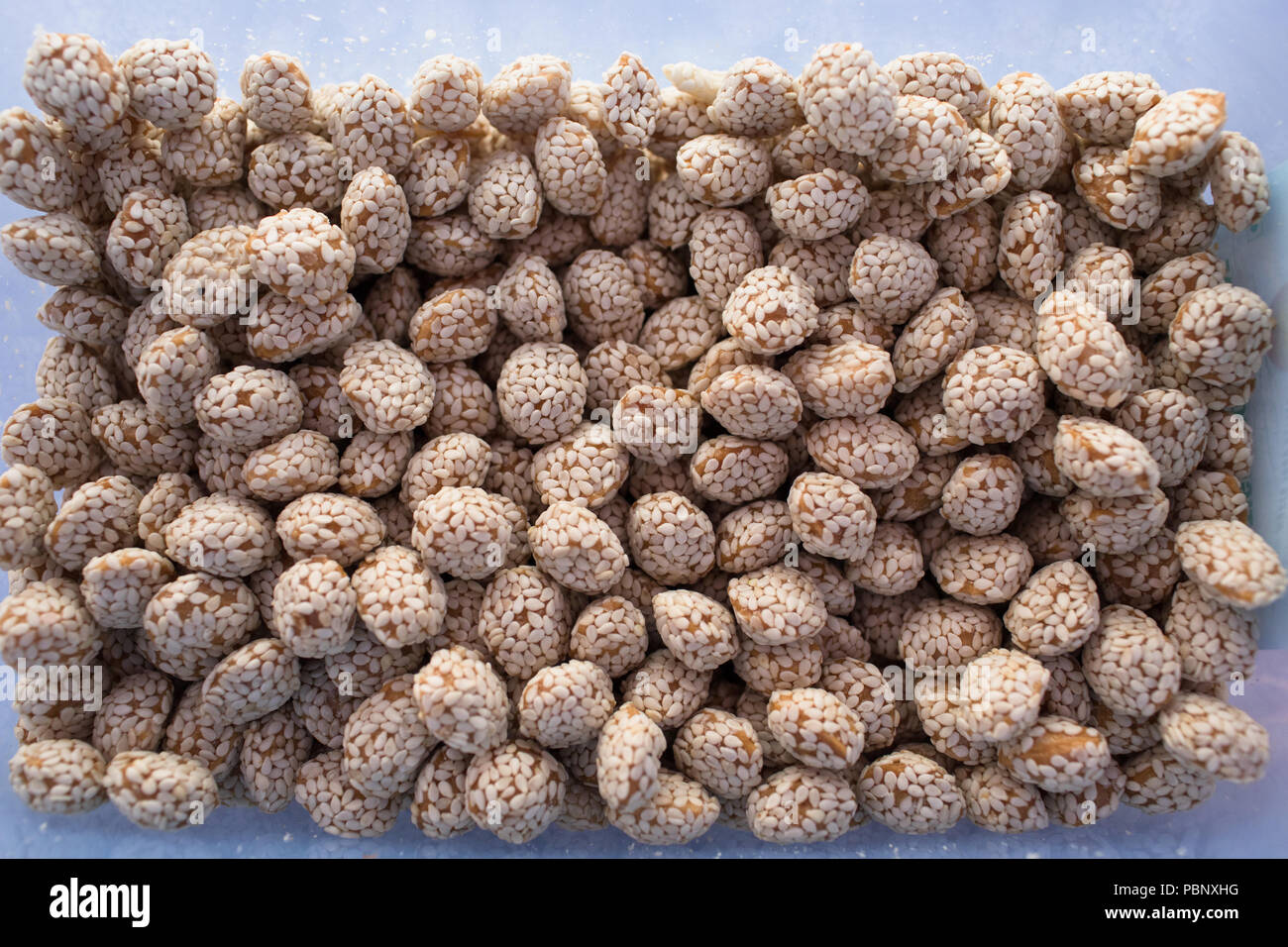 Revadi is an indian sweet made with sesame seeds and jaggery Stock