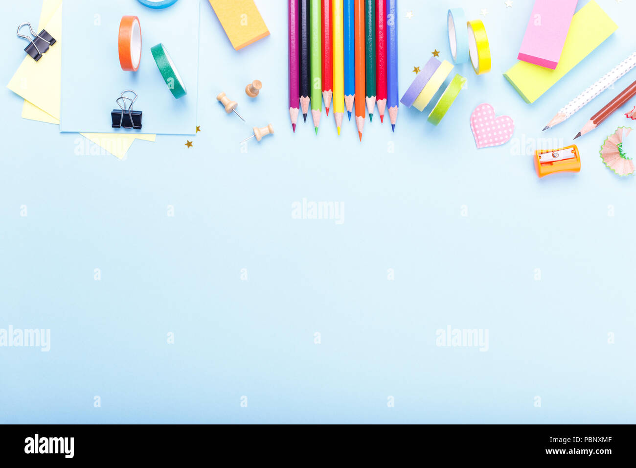 Colorful stationary school supplies on blue trending background, space ...