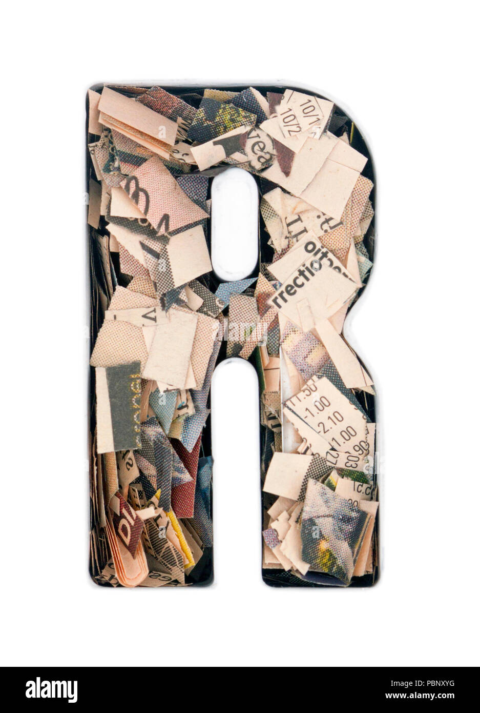 financial news newspaper cut up into confetti to make the captal letter ...
