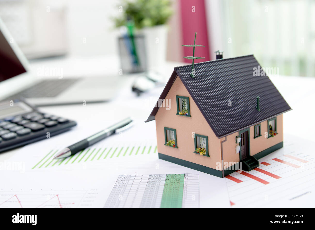 House model on desk, mortgage, investment or house building concept Stock Photo