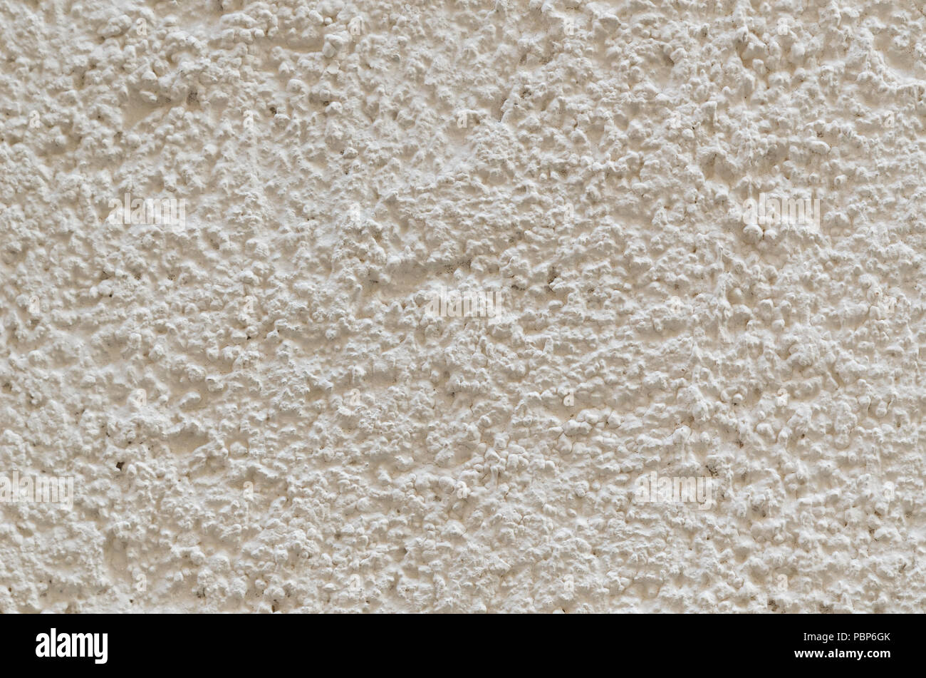 Bright whiteyellow wall texture. Porous surface background Stock Photo