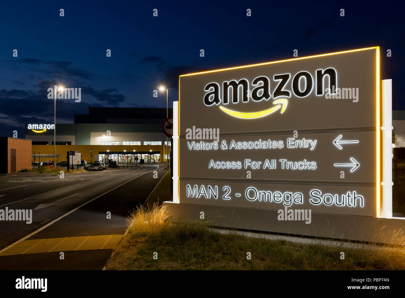 Illuminated signage at the Amazon fulfillment centre located in Warrington, UK. Stock Photo