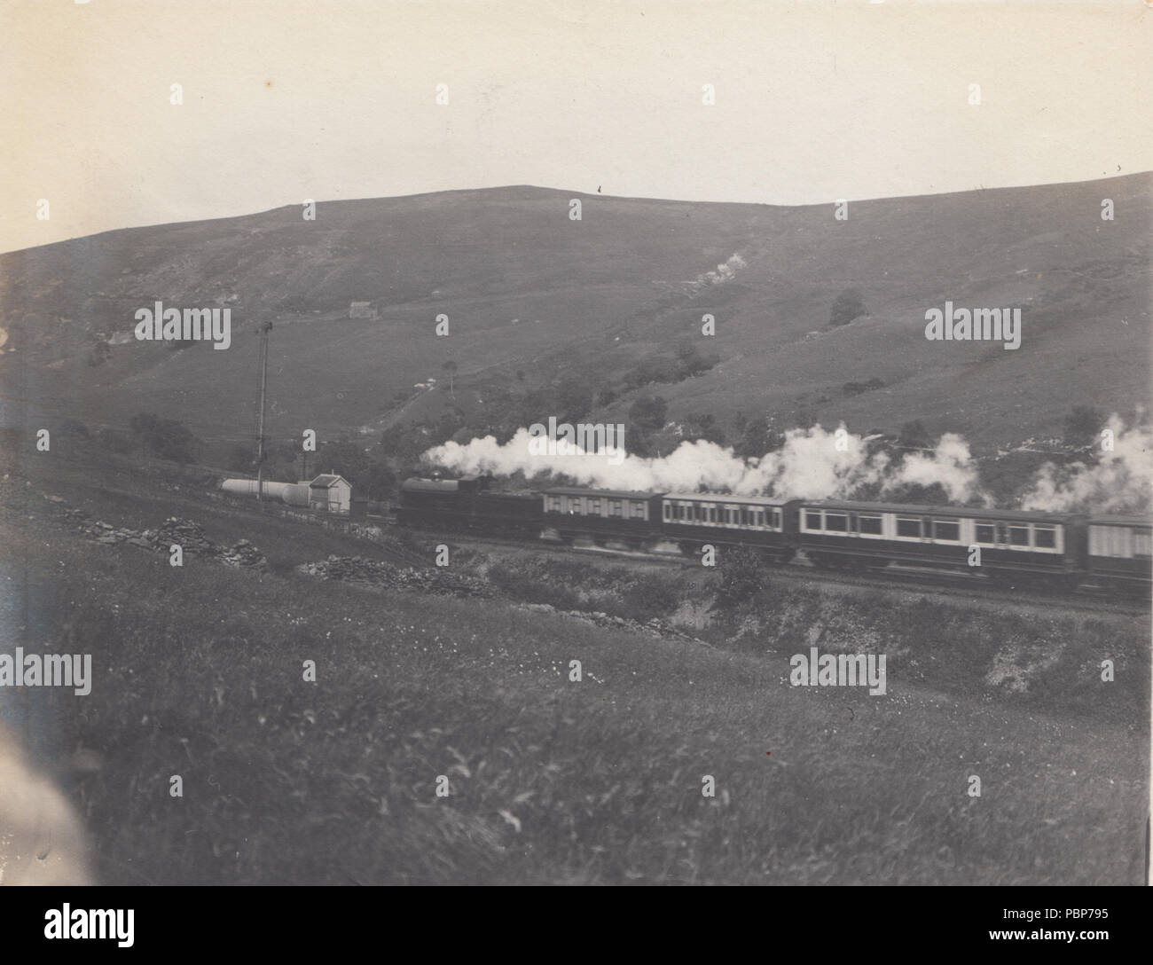 Vintage Photograph of a Steam Train Travelling Through The British Countryside Stock Photo