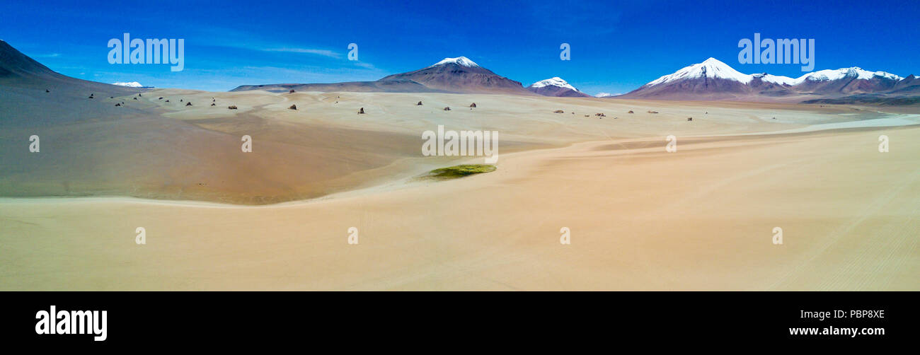 The "Siloli" Desert in the way to Uyuni Saltflats just an amazing arid landscape from an aerial view from the drone over an infinite horizon, Bolivia Stock Photo