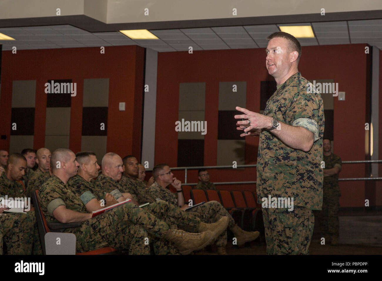 U.S. Marine Corps Lt. Col. Adam McCully, section head, Enlisted Assignment Branch, Manpower Management Division (MMEA), Headquarters Marine Corps, speaks to Marines about MMEA changes at Marine Corps Base Camp Pendleton, California, July 19, 2018. In Fiscal Year 2019, special duty assignments will be shortened down to drill instructor, recruiter and Marine Security Guard. (U.S. Marine Corps photo by Lance Cpl. Drake Nickels) Stock Photo