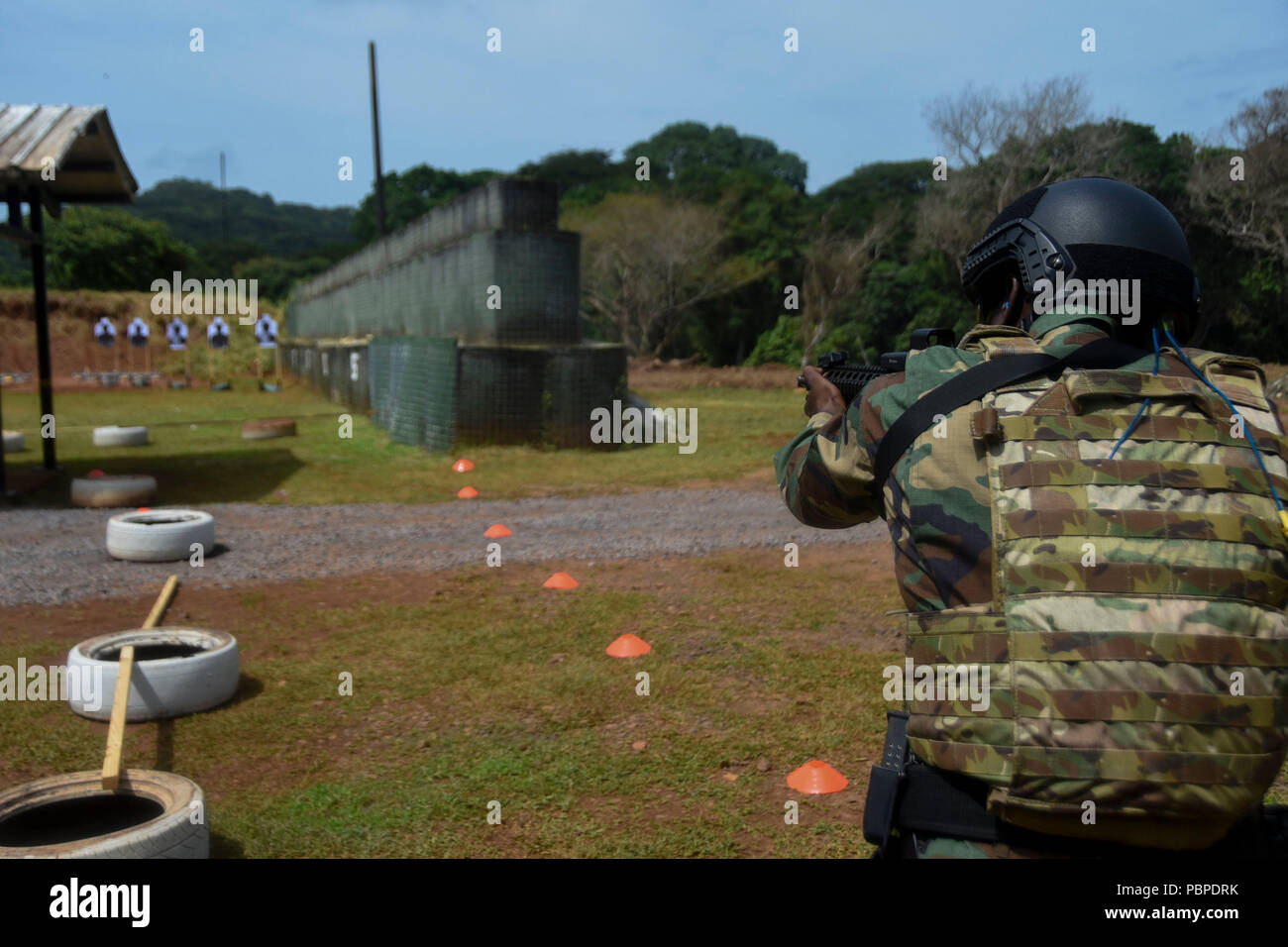 A Dominican comando shoots targets during the stress shoot, day four ...
