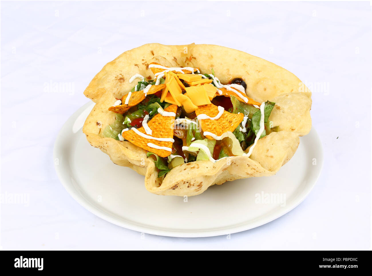 Taco salad in a baked tortilla Stock Photo Alamy
