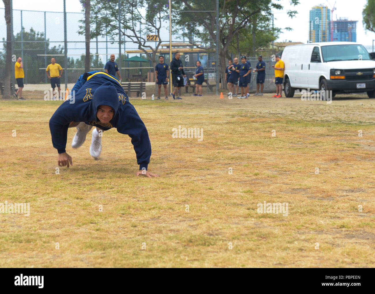 180720-N-PN275-1143 SAN DIEGO (July 20, 2018) Hospital Corpsman 3rd Class Alesandro Cabais preforms the bear crawl for an obstacle course in Naval Medical Center San Diego’s Sailor Games to observe the launch of Sailor 360. Sailor 360 is the Navy’s new leadership training curriculum, which is designed to provide meaningful training to Sailors of all ranks. (U.S. Navy Photo by Mass Communication Specialist 2nd Class Zach Kreitzer) Stock Photo