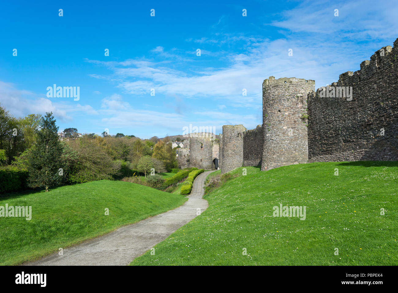 Path on the outside of the old town walls at Conwy, North Wales, UK. Stock Photo