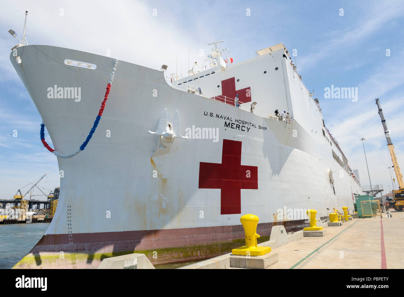 180721-N-PN275-1061 SAN DIEGO (July 21, 2018) USNS Mercy (T-AH 19) moors to the pier at Naval Base San Diego upon returning from Pacific Partnership 2018. Mercy was underway from February to July, providing public health, engineering and disaster response services to host countries to strengthen ties across the Indo-Asia Pacific region.(U.S. Navy Photo by Mass Communication Specialist 2nd Class Zach Kreitzer) Stock Photo