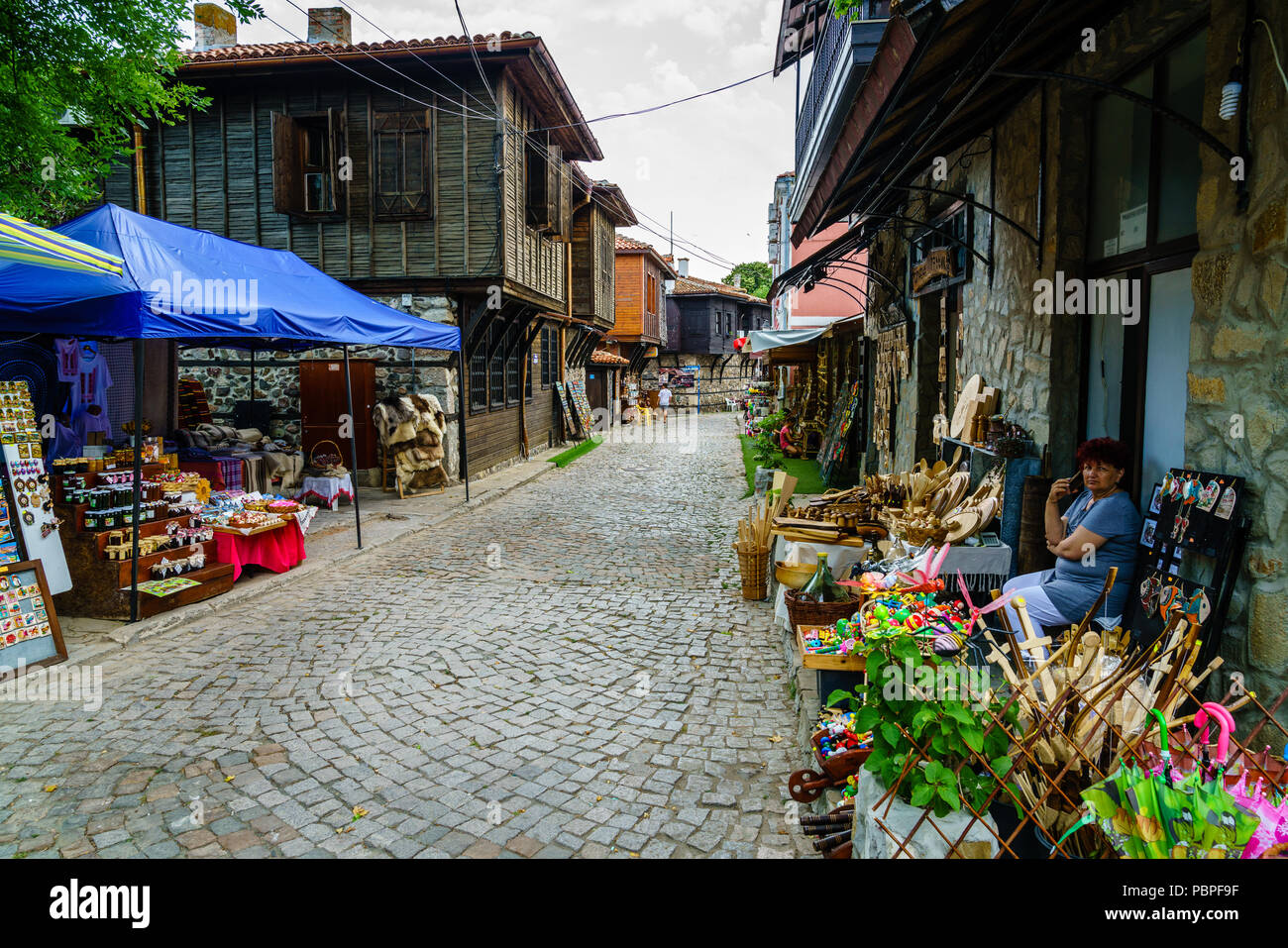 Sozopol, Bulgaria, June 27, 2017: an old cobblestone street lined with souvenir shops in resort town of Sozopol, Bulgaria Stock Photo