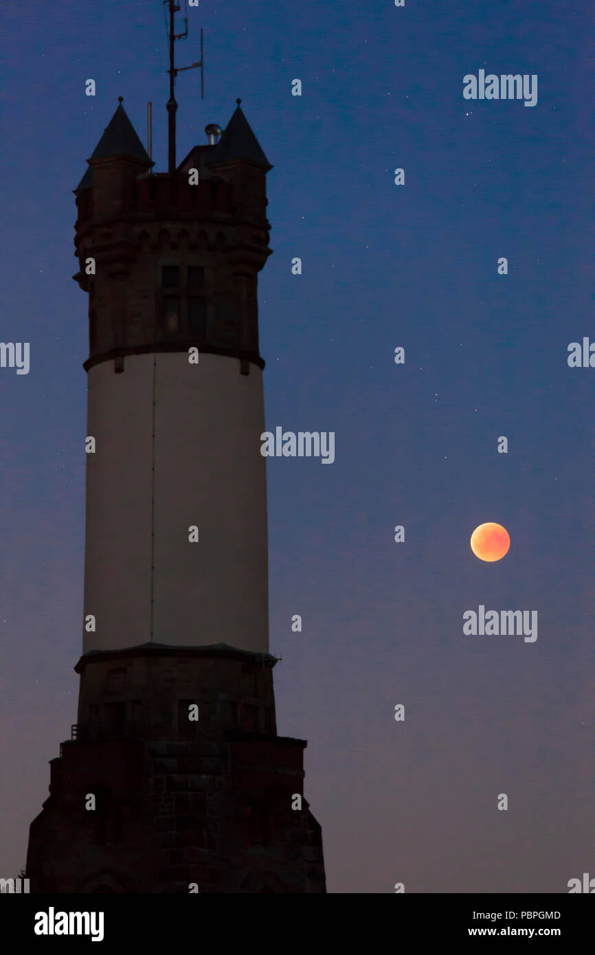 total lunar eclipse over the Harkort Tower in Wetter on the river Ruhr, blood moon, July 27th 2018, Germany.  totale Mondfinsternis ueber dem Harkortt Stock Photo