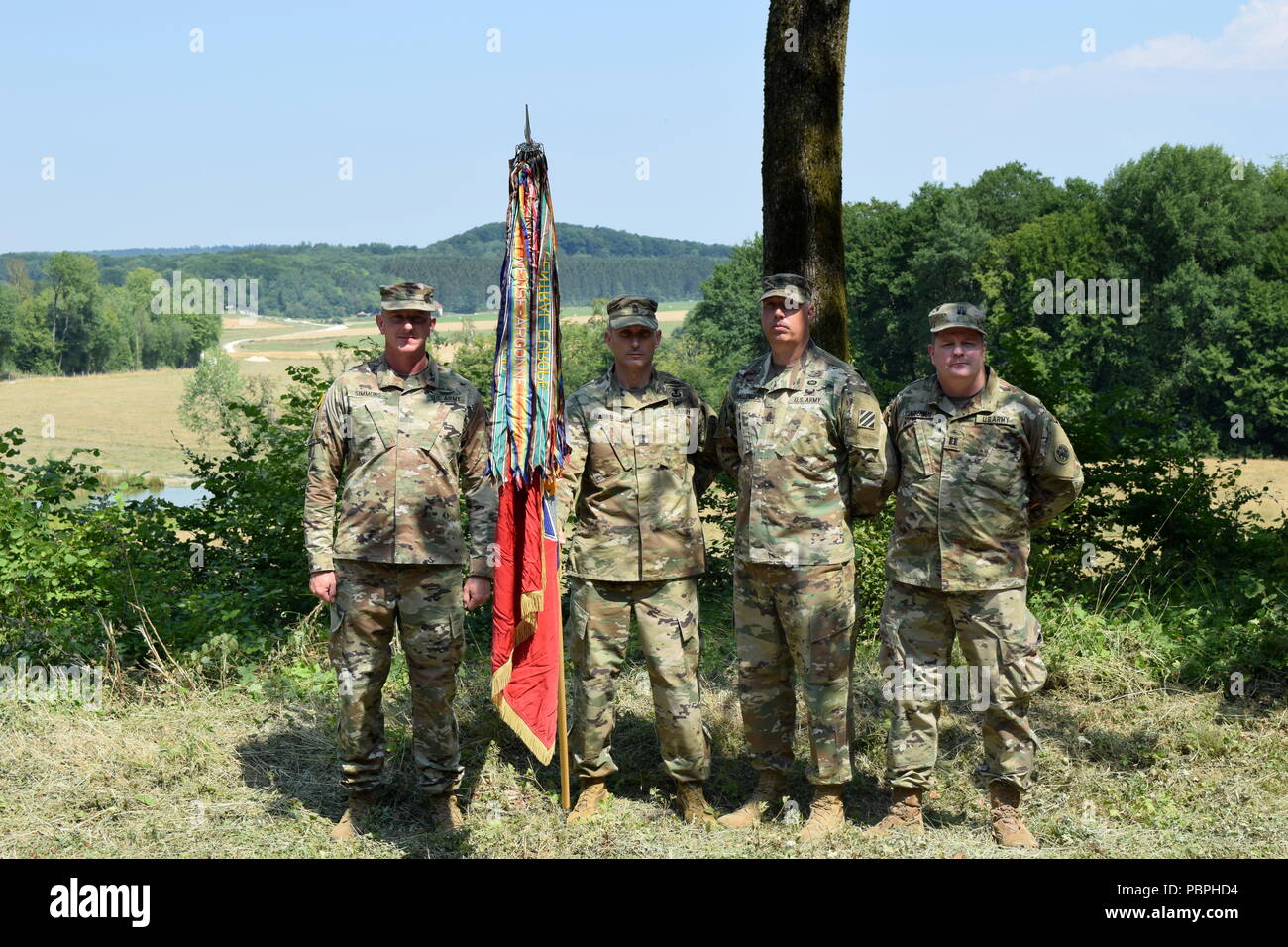 In 1918, the Macon Volunteers, then Company B of the 151st Machine Gun Battalion provided support by fire from this position during the capture of the Cote de Chatillon, a German stronghold in the Kriemhilde Stallung Line in the Meuse Argonne campaign. On July 25, 2018, The colors of the Georgia Army National Guard’s 48th Infantry Brigade Combat Team, the lineal descendant of the Macon Volunteers returned to this spot one hundred years later during the Centennial commemoration of World War I. Planting the colors are Brig. Gen. Randall Simmons, commander of the Georgia Army National Guard and p Stock Photo