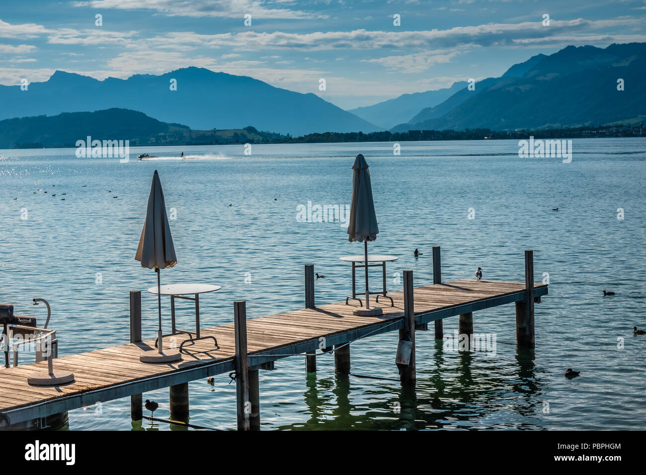Fishing dock on the shores of the Upper Zurich Lake in the beautiful