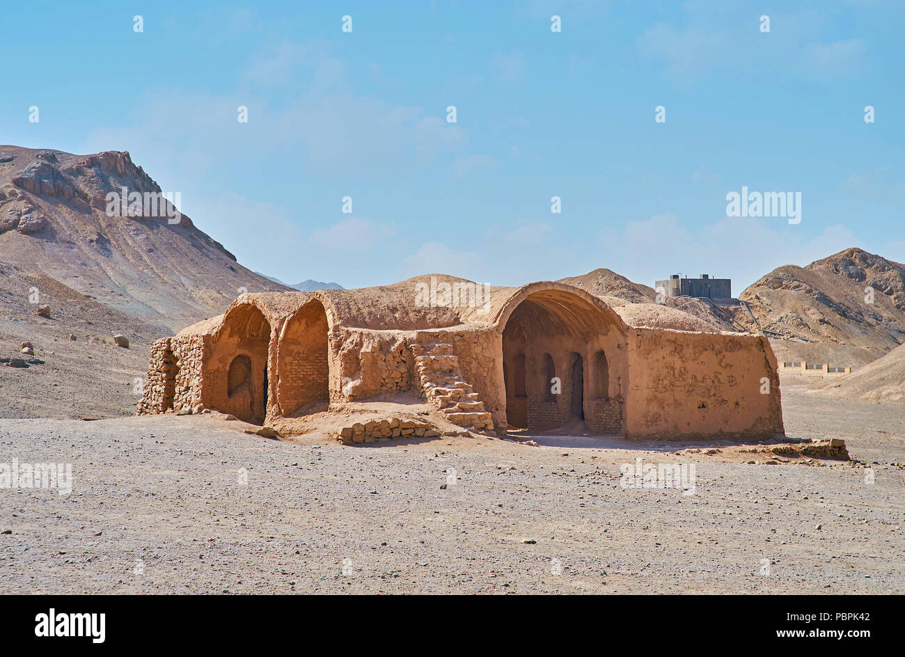 The Zoroastrian ceremonial Khaiele building is located among the rocky deserted hills in Towers of Silence archaeological site, Yazd, Iran. Stock Photo