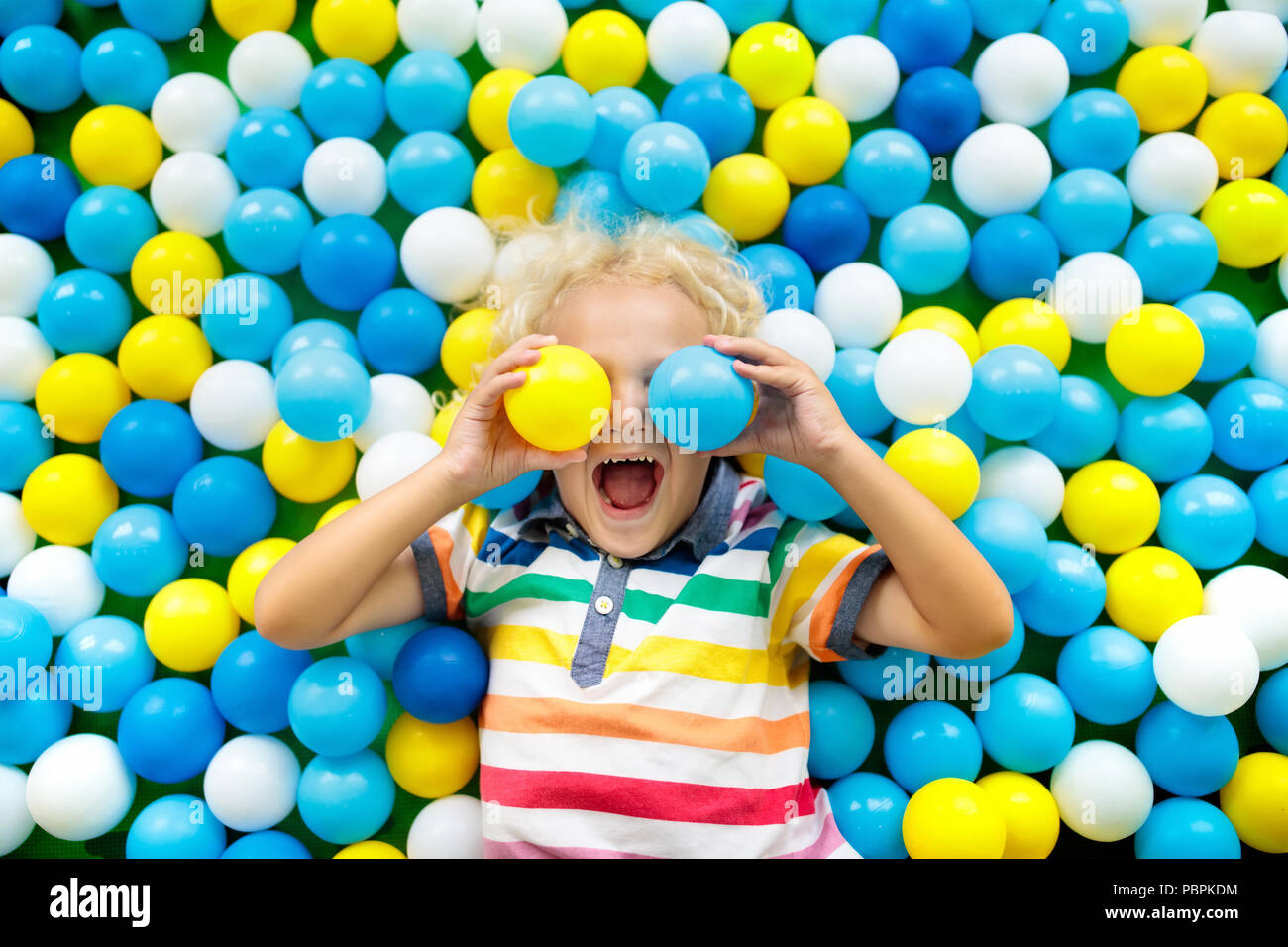 kid in ball pit