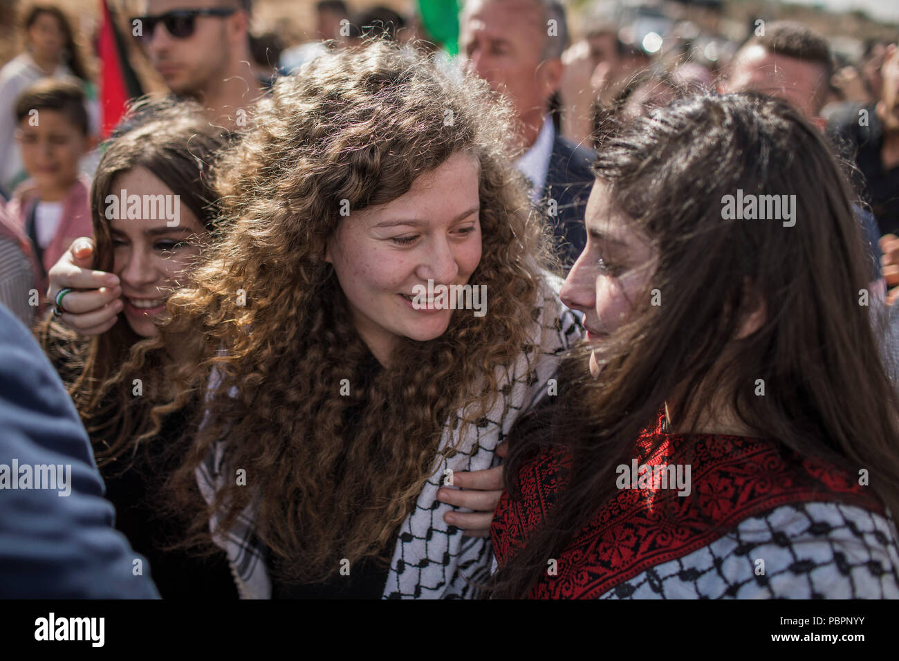 Nabi Saleh, West Bank. 29th July, 2018. Palestinian activist Ahed Tamimi (C) reacts after her release from an Israeli prison where she served a sentence of eight months for slapping an Israeli soldier in her hometown of Nabi Saleh, West Bank, 29 July 2018. Credit: Ilia Yefimovich/dpa/Alamy Live News Stock Photo