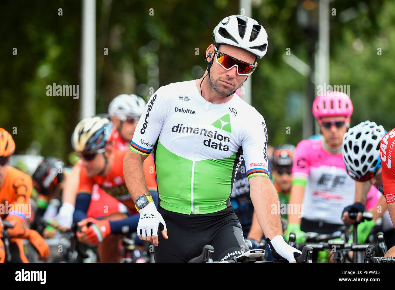 London, UK. 29 July 2018. Mark Cavendish (Team Dimension Data) joins riders  gathered on the start line for the Prudential RideLondon-Surrey Classic,  Britain's only men's UCI WorldTour race and the world's richest