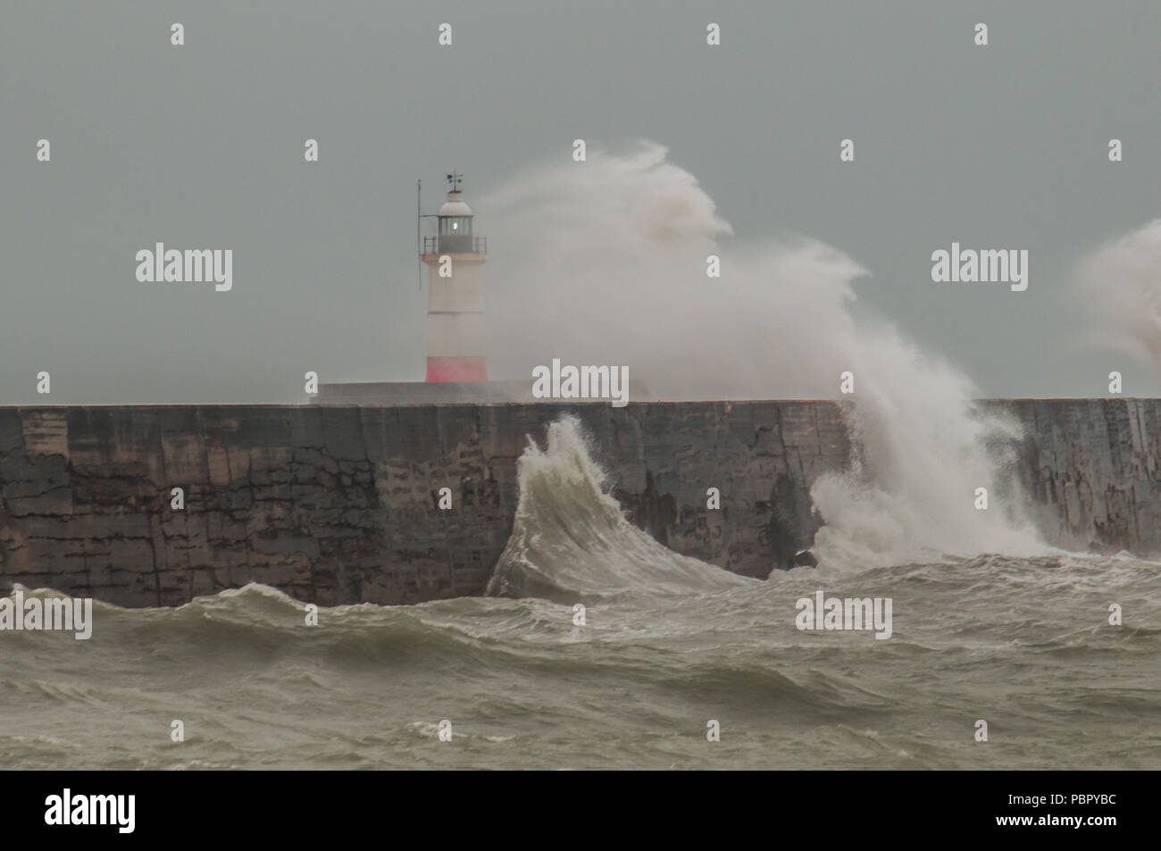 Newhaven, East Sussex, UK..29 July 2018..A refreshing  change in the weather as strong wind from the SW, with very welcome rain, whips up the sea off the South coast... Stock Photo