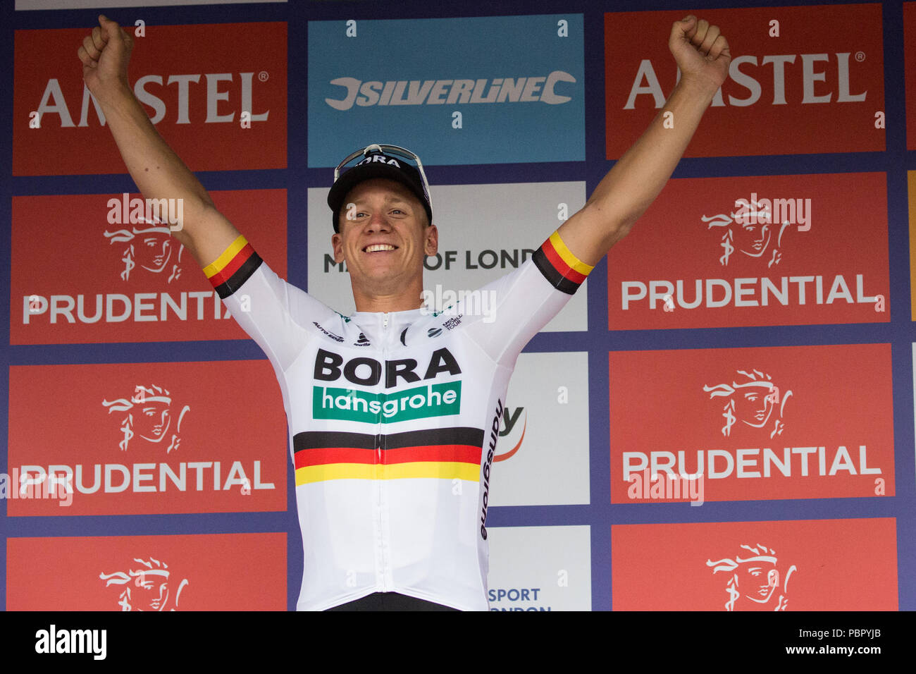 London, UK. 29th July, 2018. Pascal Ackermann of the Bora-Hansgrohe team celebrates winning the Prudential RideLondon-Surrey Classic, Britain's only men's UCI World Tour race and the world's richest one-day race with prizes worth 100,000 Euros to be won. Stock Photo