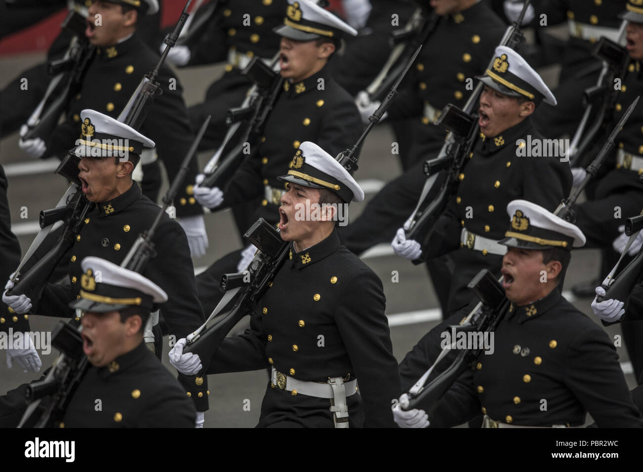 Lima, Lima, Peru. 29th July, 2018. Peruvian officers seen participating in the military parade.Members of Peru's armed forces, coastguard, search & rescue, and police march in full uniform during the country's Gran Parada Militar. This parade always occurs the day after Peru's Independence Day marking the official end of festivities across the nation. Credit: Guillermo Gutierrez/SOPA Images/ZUMA Wire/Alamy Live News Stock Photo