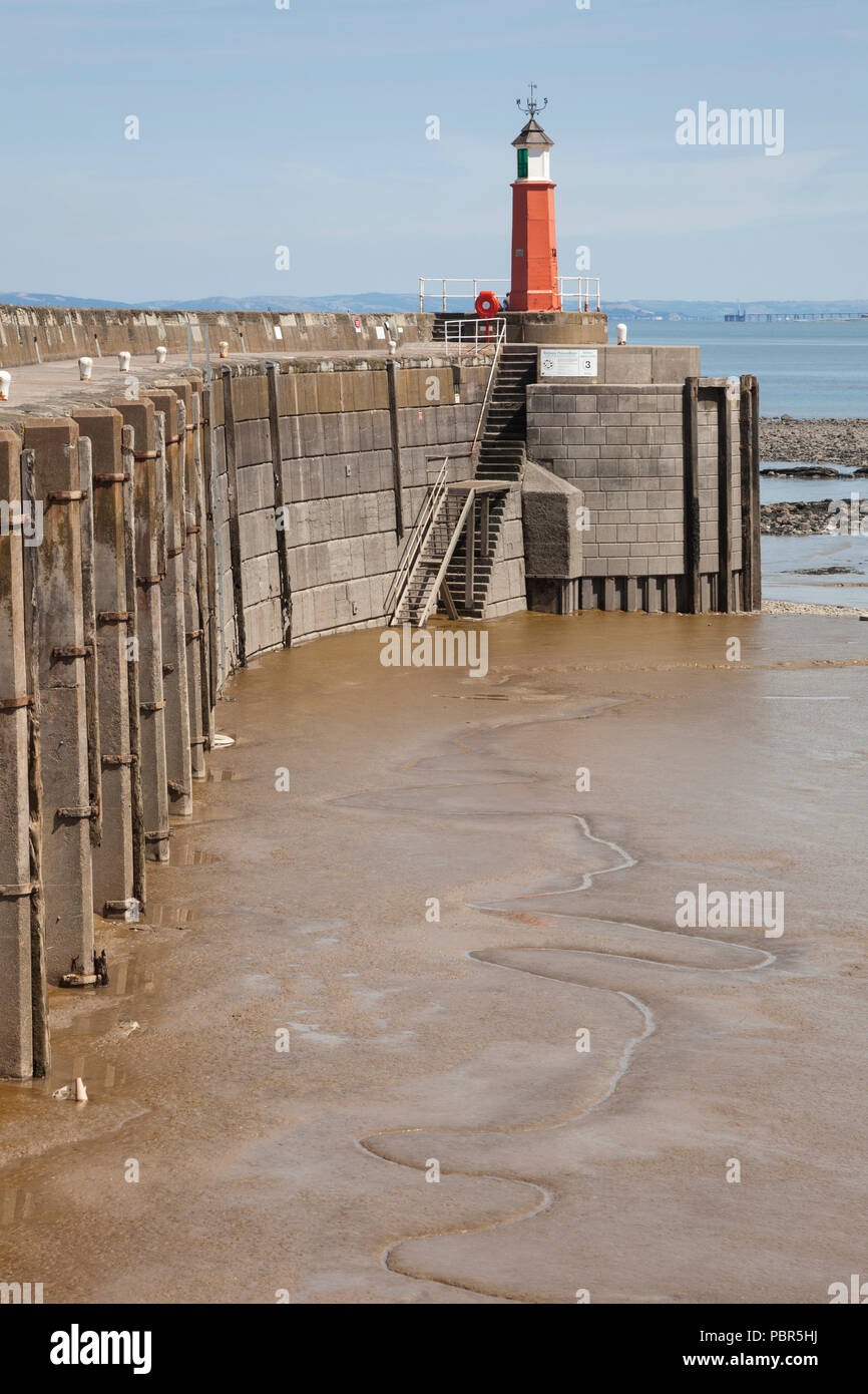 Watchet Somerset harbout lighthouse and sea wall Stock Photo