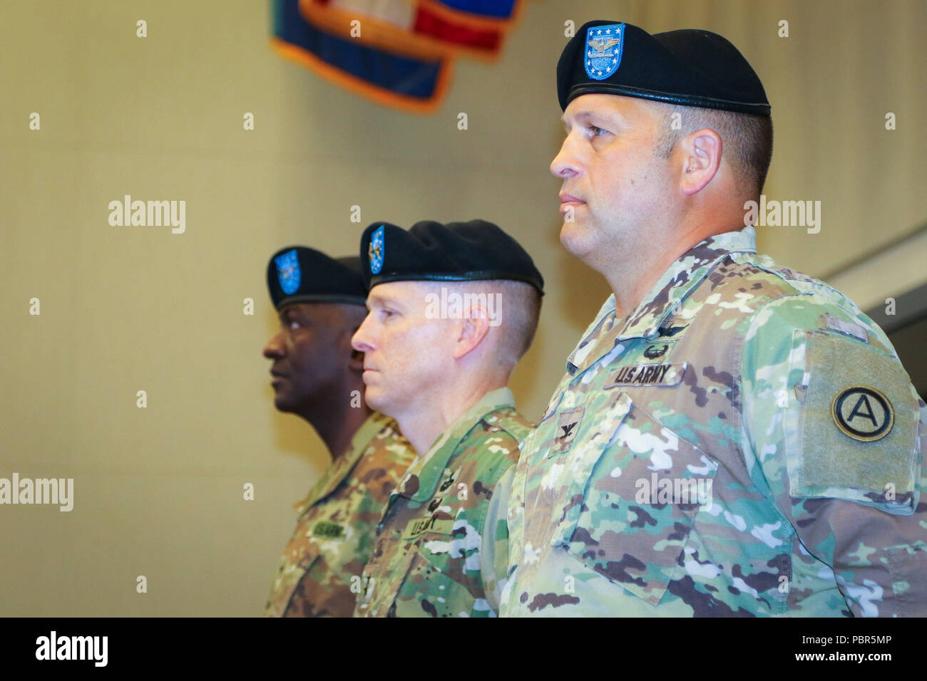 Col. Douglas W. Mills, incoming commander of the 2503rd Digital Liaison Detachment, Maj. Gen. David C. Hill, deputy commanding general, U.S. Army Central, and Col. Oscar W. Doward Jr., outgoing commander of the 2503rd DLD, stand at attention during a change-of-command ceremony July 19, 2018, at Patton Hall on Shaw Air Force Base, S.C. (U.S. Army photo by Sgt. Von Marie Donato) Stock Photo