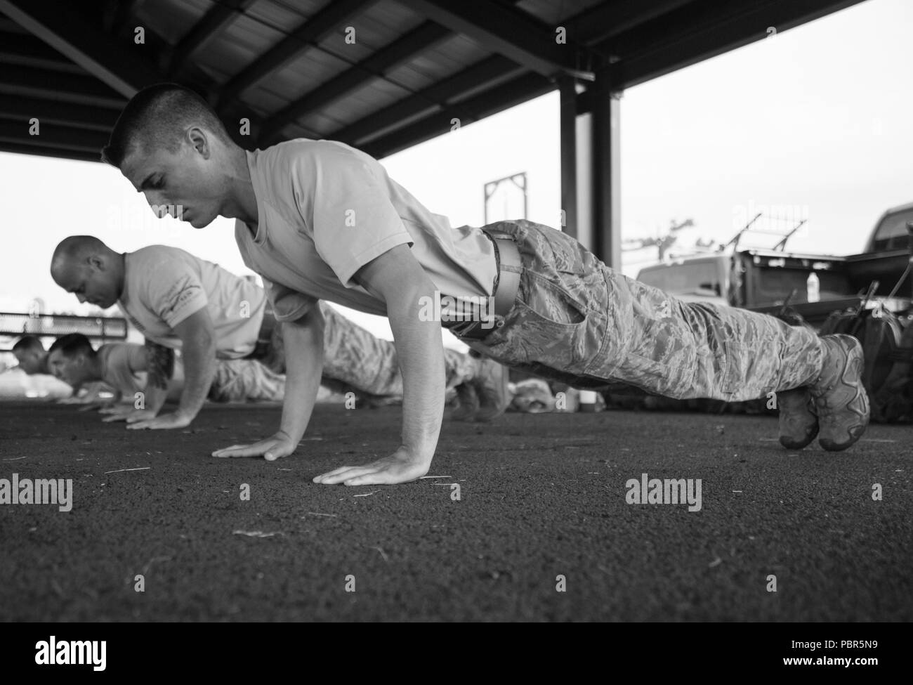 Senior Airman Nick Lodge, 811th Security Forces Squadron response force member, performs pushups as part of a security forces defender competition on Joint Base Andrews, Md., July 23, 2018. The defenders were competing to represent the Air Force District of Washington in the Defender Challenge 2018 at Camp Bullis, San Antonio, Texas. The defender’s challenge will give the Air Force and partnering allies such as the Royal Air Force, the German Luftwaffe, the Royal Australian Air Force and the Royal Canadian Air Force a way to showcase their military police capabilities and joint interoperabilit Stock Photo