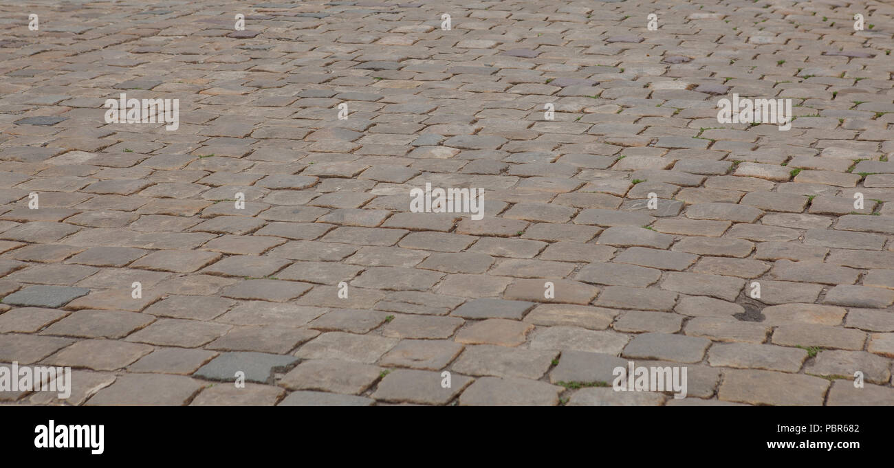 Abstract background of old cobblestone pavement close-up Stock Photo ...