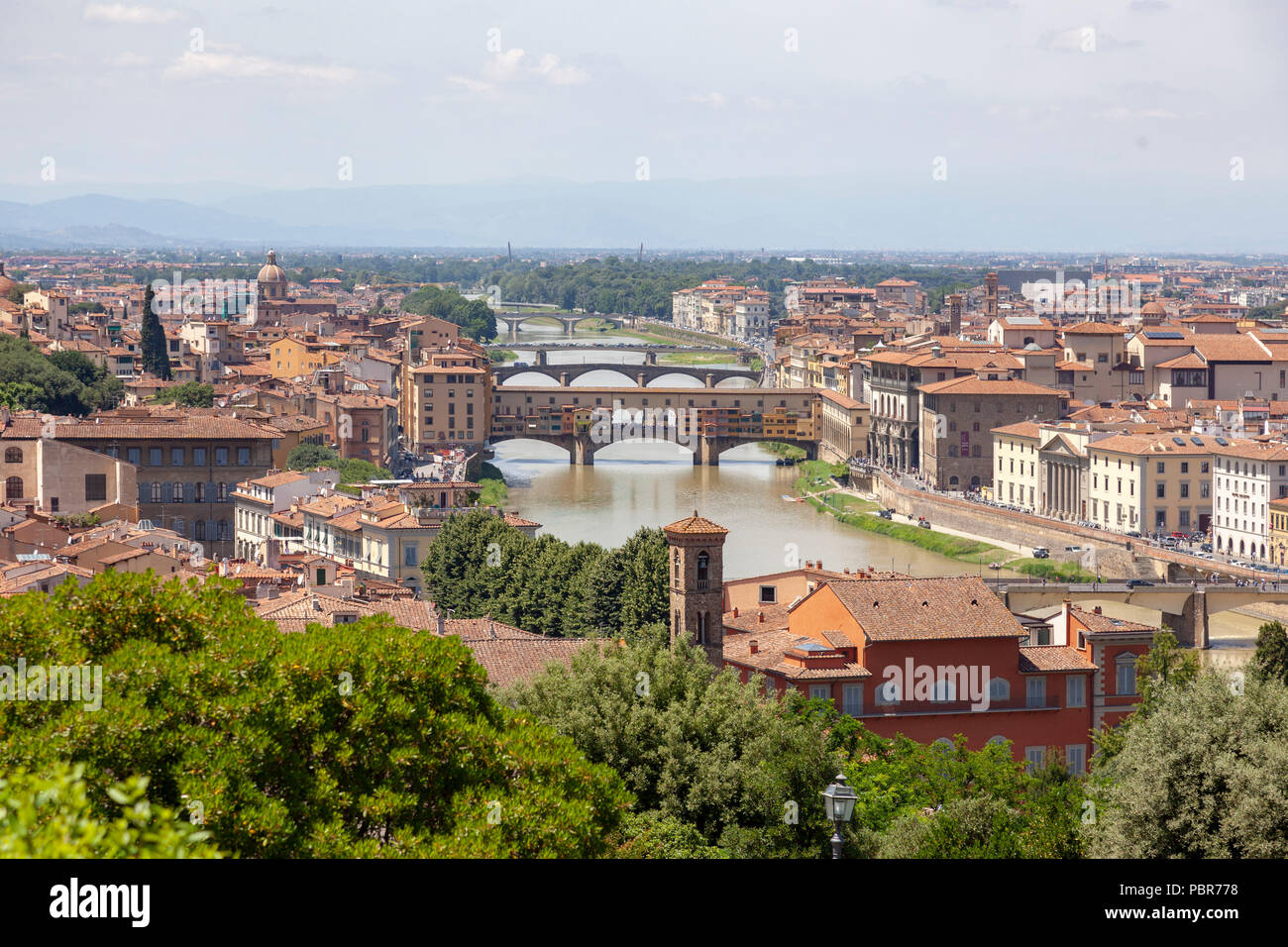 The bridges of Florence on the Arno river (Tuscany - Italy). Seen from the Eastern vantage point of the Michelangelo Square, the iconic Ponte Vecchio  Stock Photo