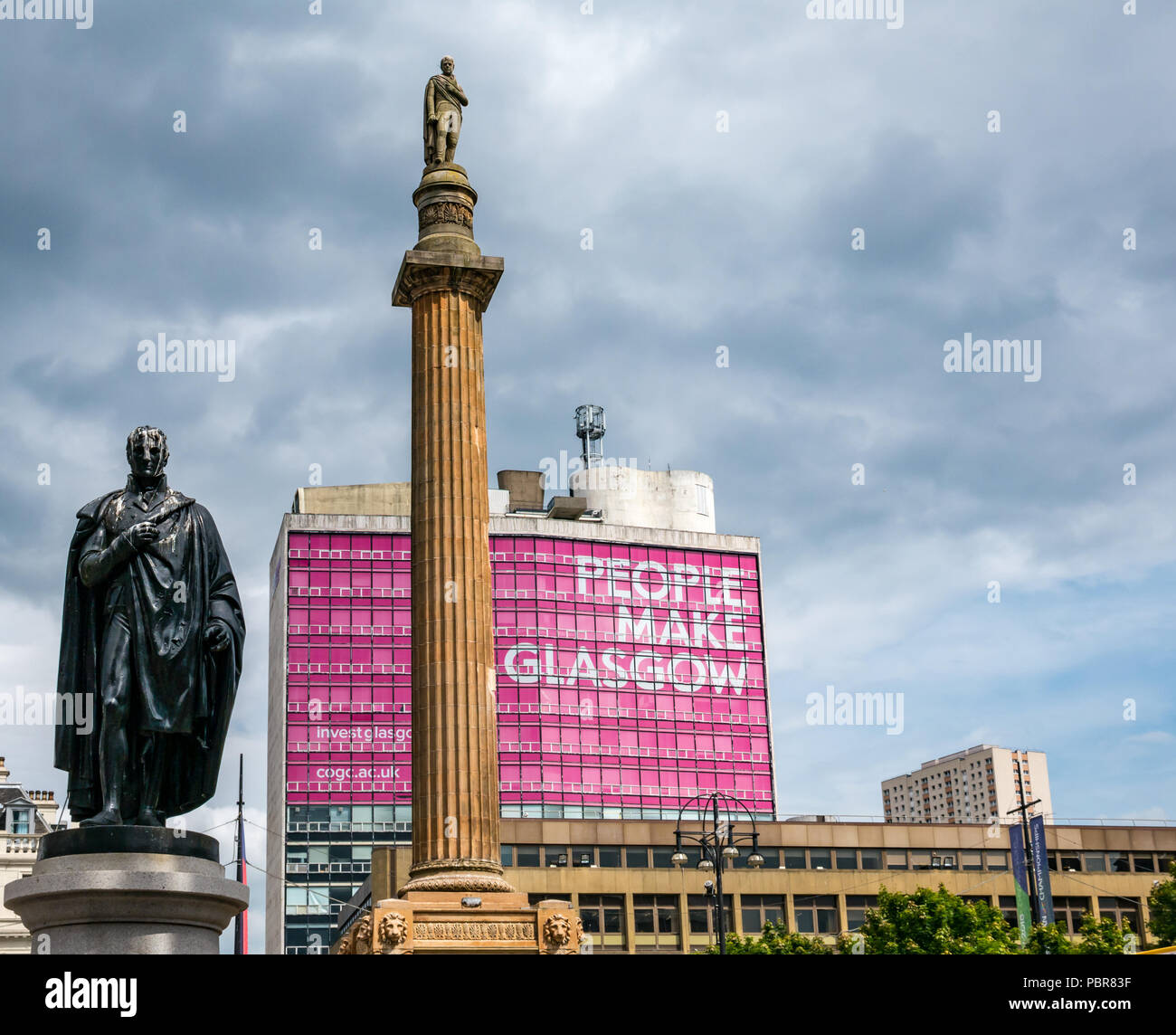 Sir John Moore statue, Sir Walter Scott memorial column and pink People Make Glasgow advert and stormy sky, George Square, Glasgow, Scotland, UK Stock Photo