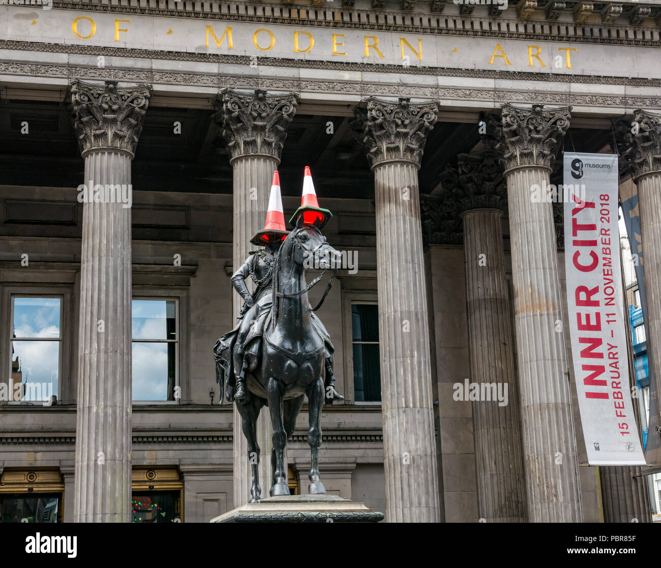 Equestrian statue Duke of Wellington with traffic cones, Gallery of Modern Art, GoMA, Royal Exchange Square, Glasgow, Scotland, UK Stock Photo