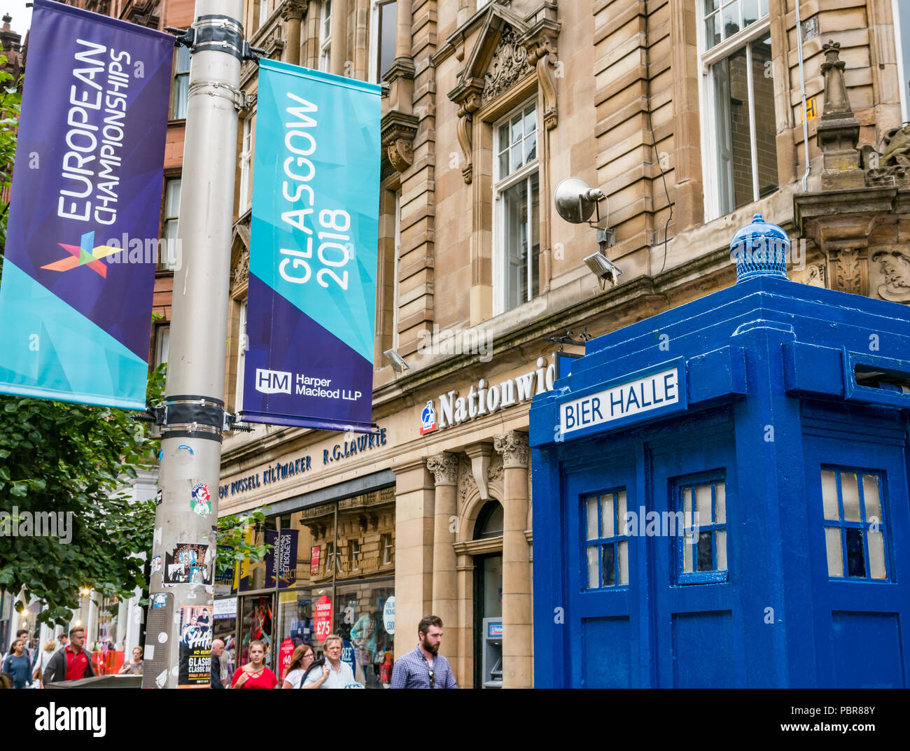 Freshly painted Tardis police call box named Bier Halle and 2018 European Championships banners, Buchanan Street, Glasgow, Scotland, UK Stock Photo