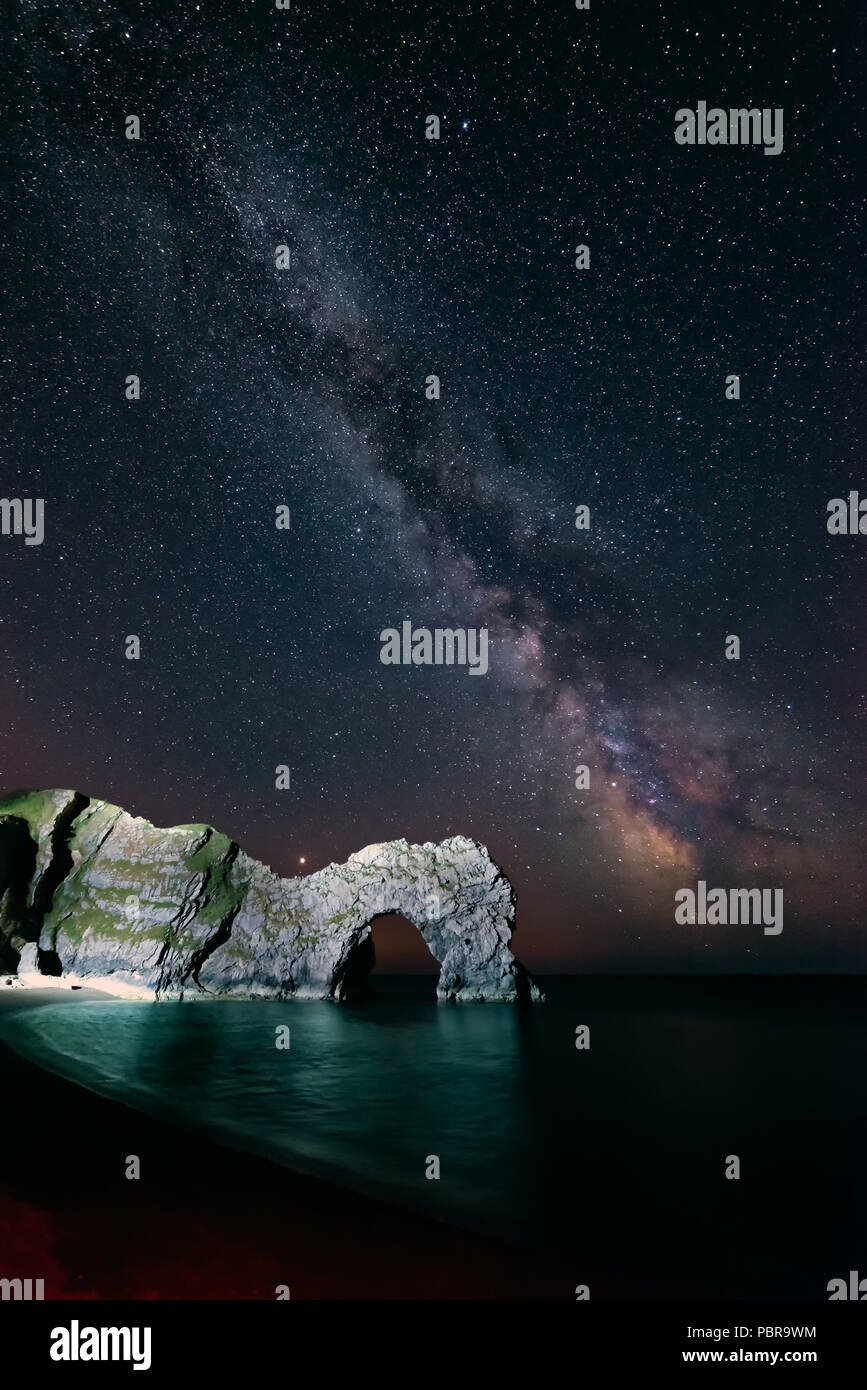 Stunning colorful image of Milky Way galaxy over sea landscape in