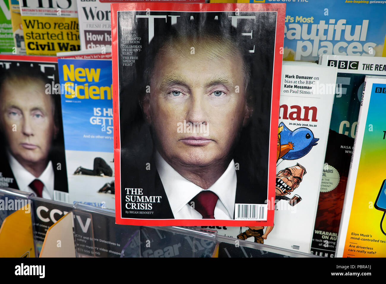 Time magazine cover July 2018 Vladimir Putin and Donald Trump portrait blend with other magazines on newsagent shelf WH Smith London UK  KATHY DEWITT Stock Photo