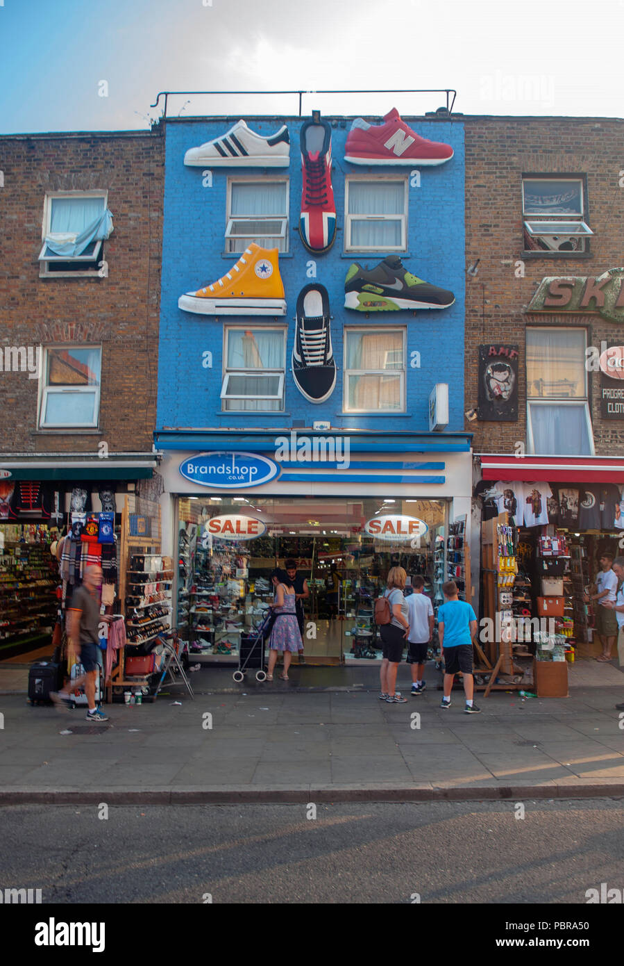 Large trainers above a shoe shop in Camden Town Stock Photo