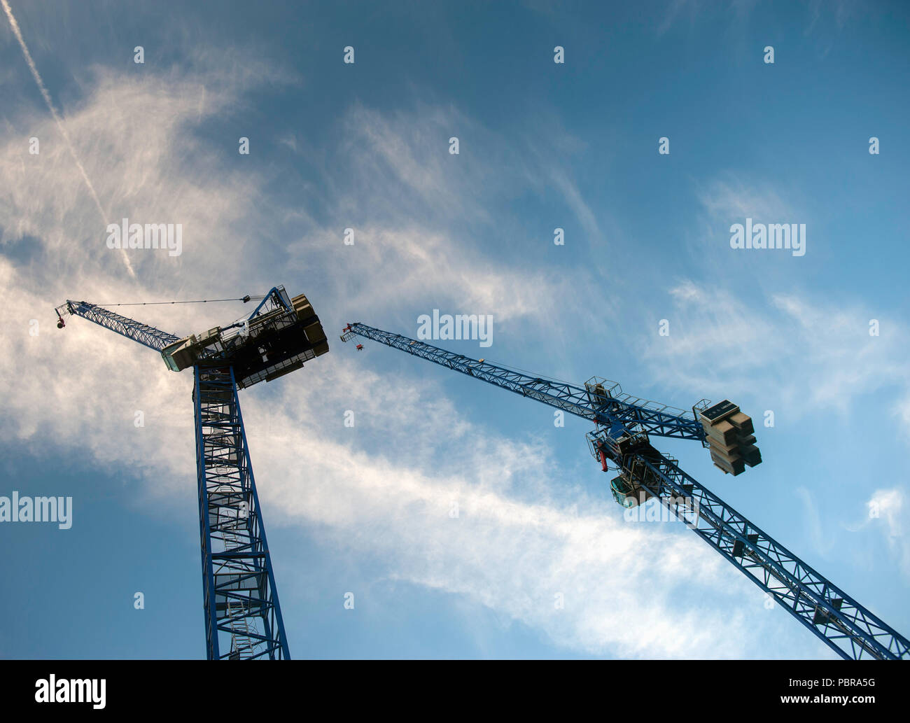 Cranes with ballast on a construction site Stock Photo