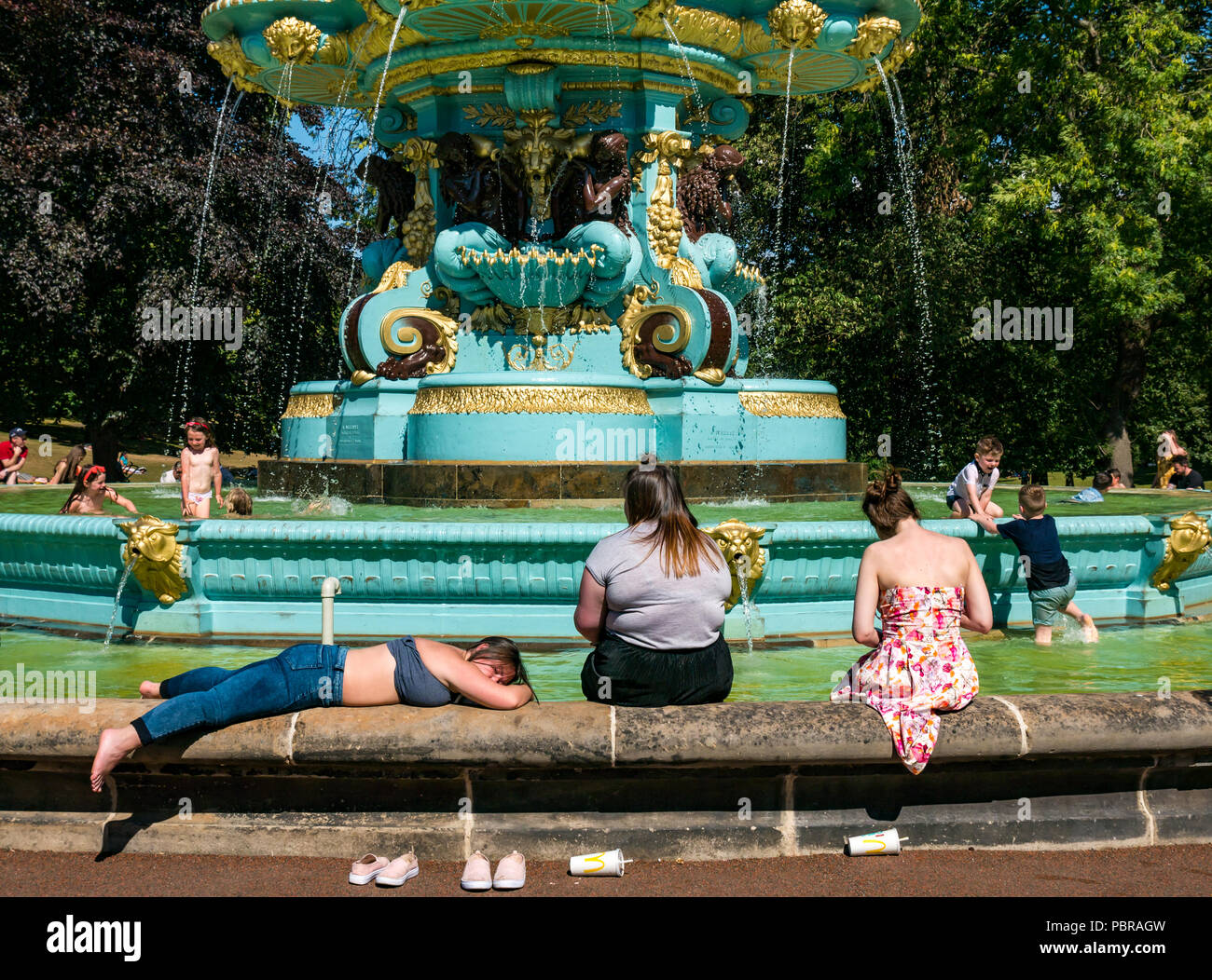 uk-woman-sunbathing-uk-heatwave-high-resolution-stock-photography-and