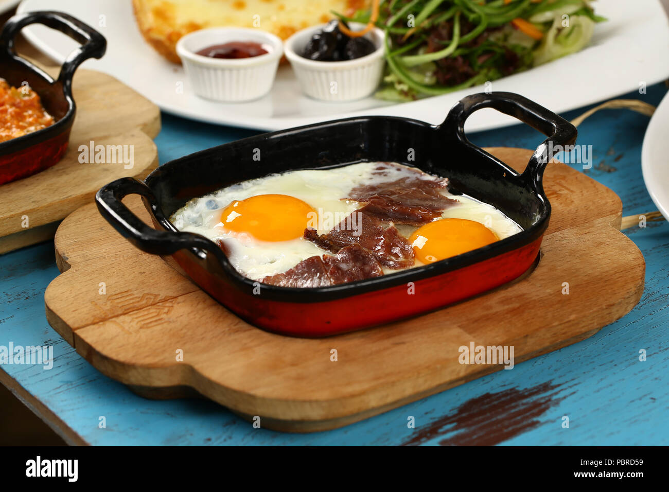 Fried egg with braised meat Stock Photo Alamy